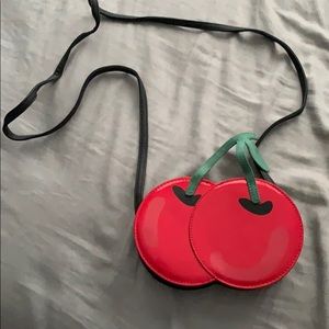 A cherry bag that has straps